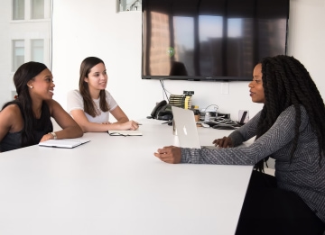 a group of people sitting around a table