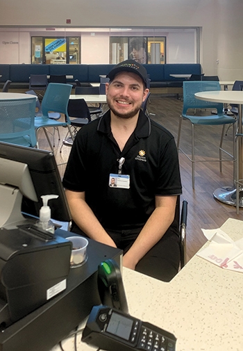 Alex-Lovett-at-cash-register,-Dayton-Children_s.jpg